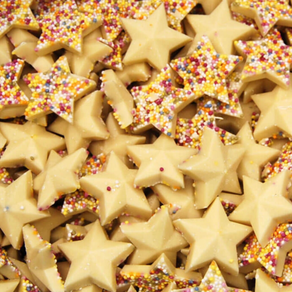 Star-shaped white chocolate sweets with hundreds and thousands

